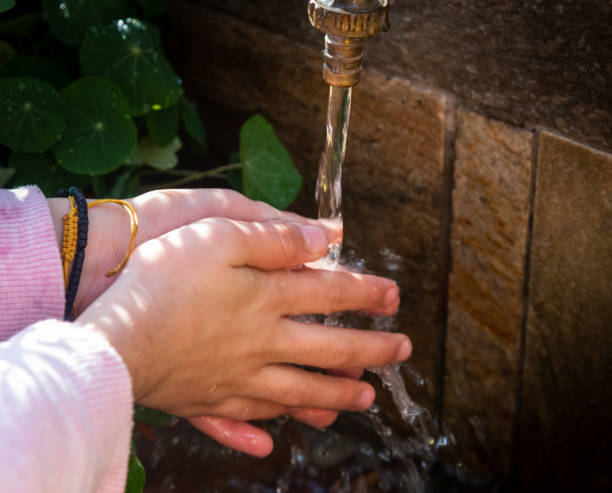 istock Young child washing hands with water 1204269071