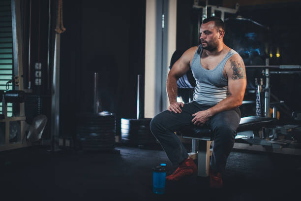 istock Man weightlifter at the gym 1204269299