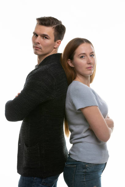 istock A couple with big problems stand with their backs to each other and look into the frame 1204270747