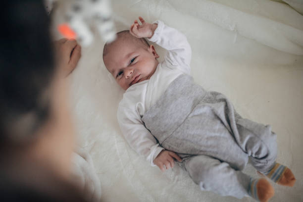 istock Newborn baby boy lying down in crib 1204270813