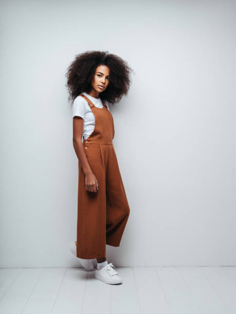 istock Beautiful smiling girl with curly hairstyle 1204271364