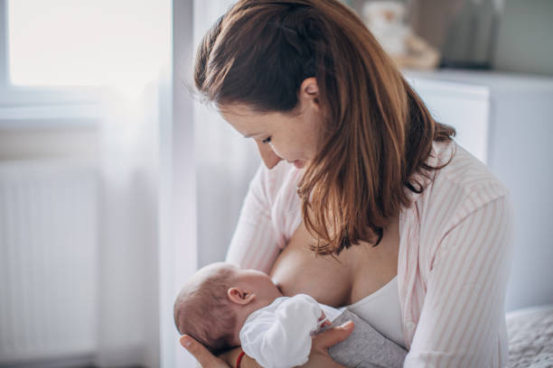 istock Mother breastfeeding baby boy 1204271480