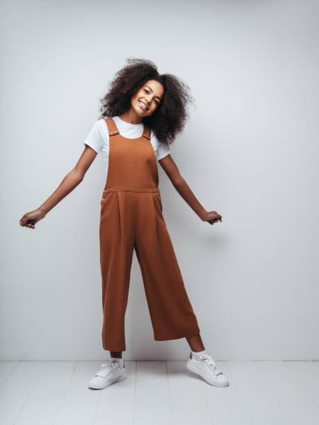 istock Beautiful smiling girl with curly hairstyle 1204271503