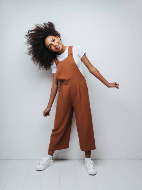 istock Beautiful smiling girl with curly hairstyle 1204272148