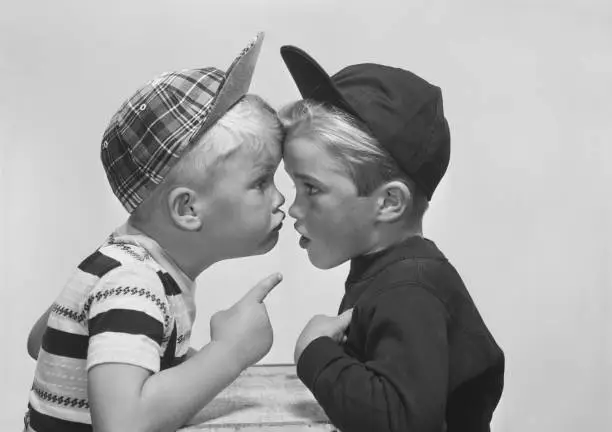 Photo of Two boy arguing, close-up