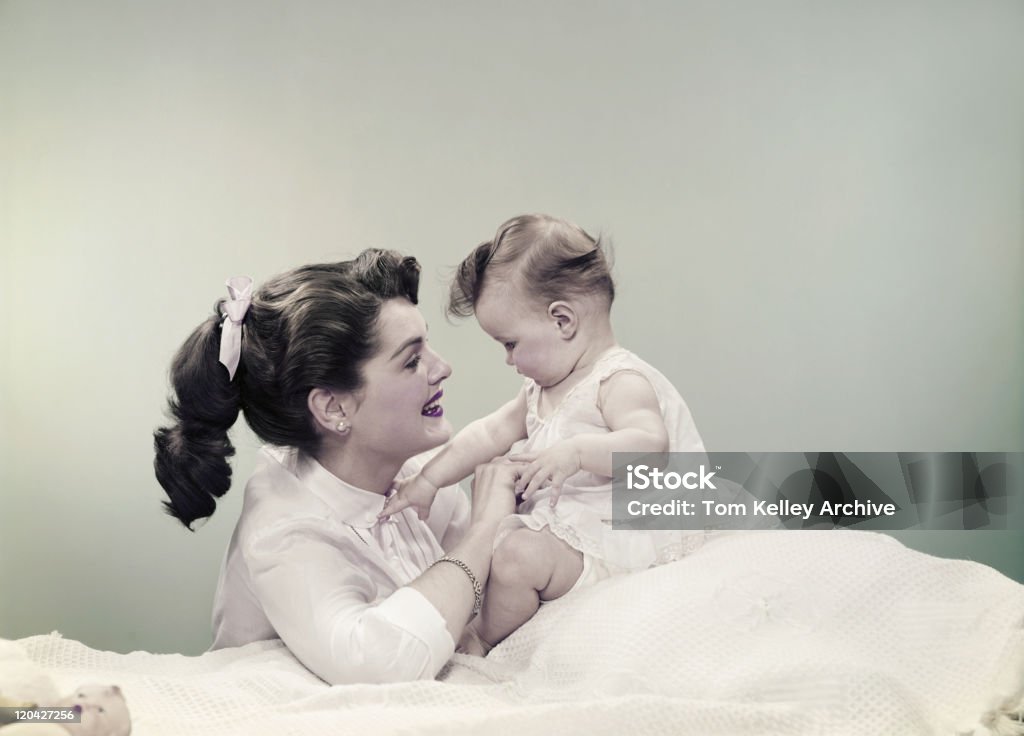 Mother with baby, smiling  Archival Stock Photo