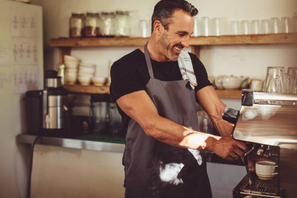 istock Barista working in coffee shop 1204272649