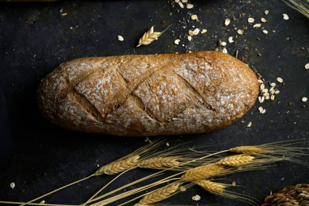 istock Wholegrain Bread Loaf Cut into Slices 1204272743