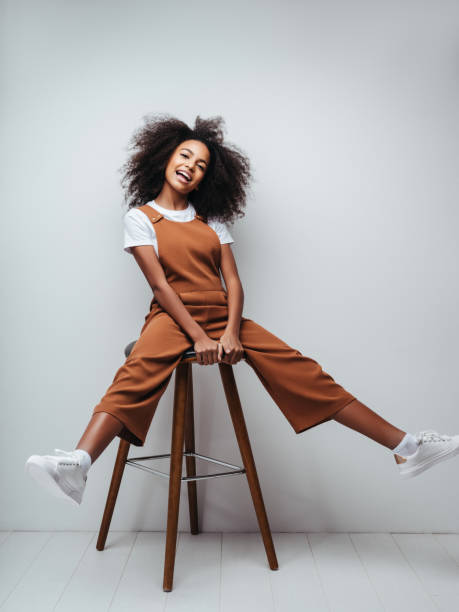 istock Beautiful smiling girl with curly hairstyle 1204272885