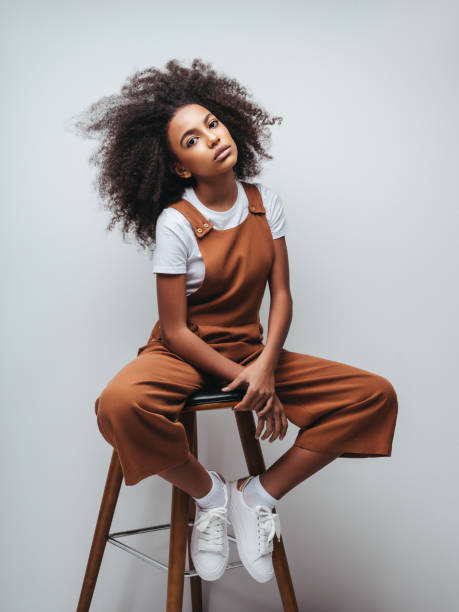 istock Beautiful smiling girl with curly hairstyle 1204273086