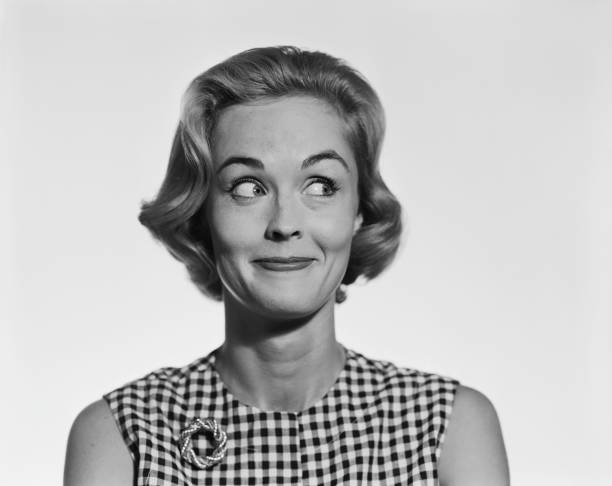 Young woman glancing sideways, smiling archival stock pictures, royalty-free photos & images