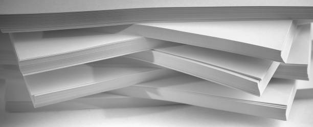 istock Several stacks of white paper on a white background 1204274269