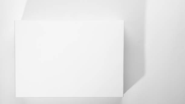 istock Stack of white office paper on light background, top view, place for text. 1204274301