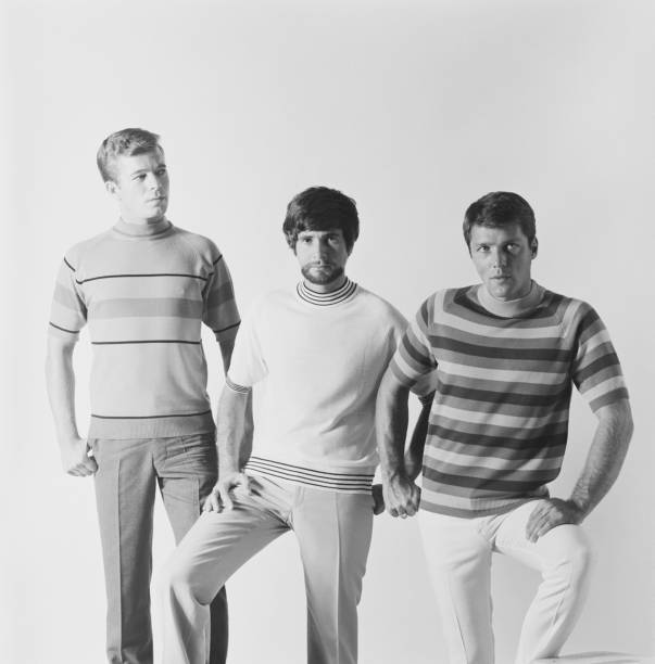 Young man standing against white background, portrait  1968 stock pictures, royalty-free photos & images