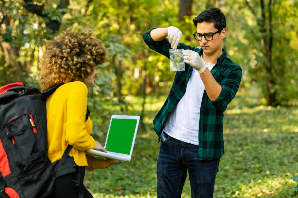 istock Scientist ecologist in the forest take samples of plants. 1204276462