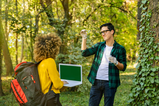 istock Scientist ecologist in the forest take samples of plants. 1204277287