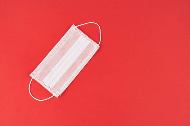 istock Corona virus, lassa virus isolated needle medication red background 1204277387