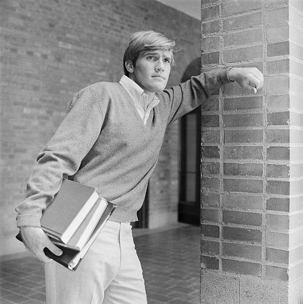 Young man holding books in hand  1969 stock pictures, royalty-free photos & images