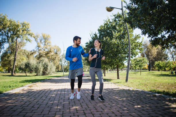 istock Young couple enjoyning morning run 1204277518