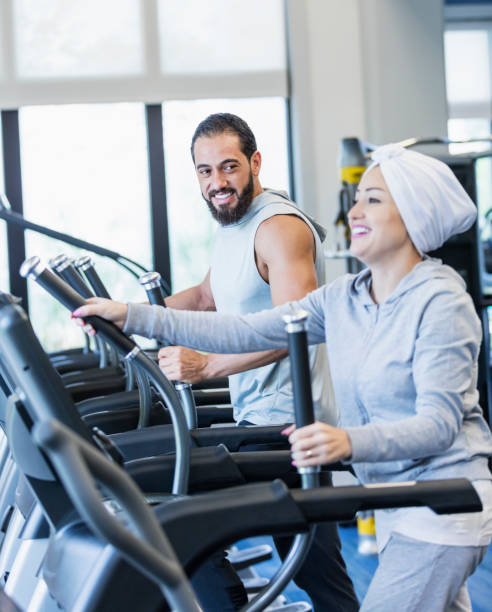 istock Middle Eastern couple exercising at the gym 1204277929