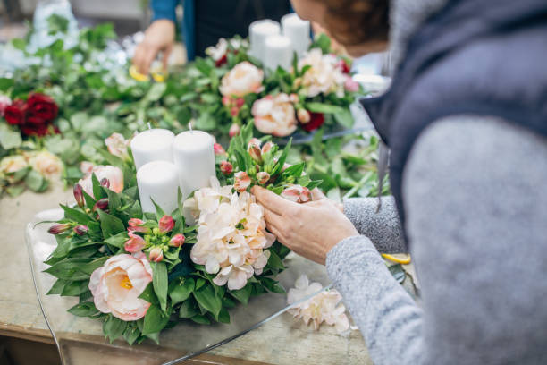 istock Women arranging flowers 1204280144