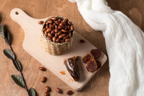 istock Wicker bowl full of black beans on a wooden board 1204280232