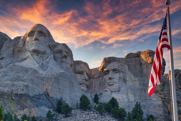 Four Presidents 3 Keystone, South Dakota / USA - August 2, 2016:  An American flag waves in front of Mount Rushmore National Memorial. george washington photos stock pictures, royalty-free photos & images