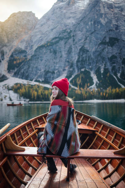 istock Young Girl with Plaid Sitting in a Boat 1204280433