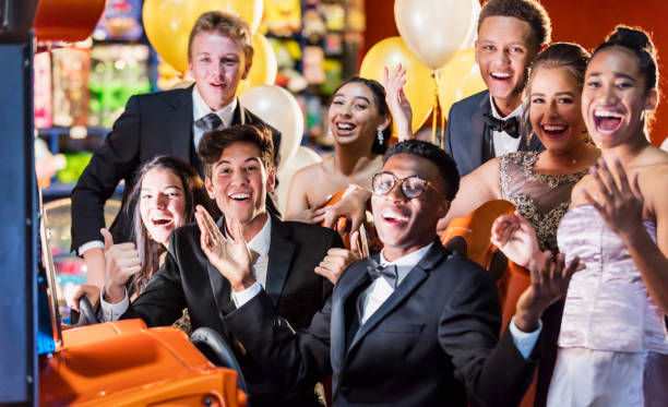 istock Teenagers after prom at video arcade 1204280869