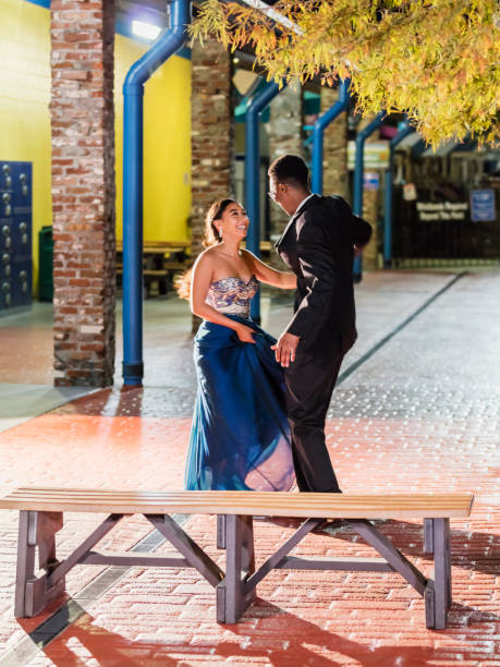 istock Multi-ethnic teenage couple at prom, dancing alone 1204281007