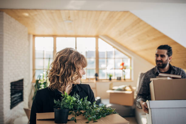 istock Couple moving in into new apartment 1204282394