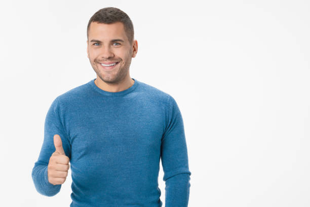istock Happy handsome man showing thumb up isolated on white background 1204283036