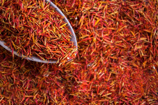 istock Stamens of red saffron texture closeup. Spice 1204286877