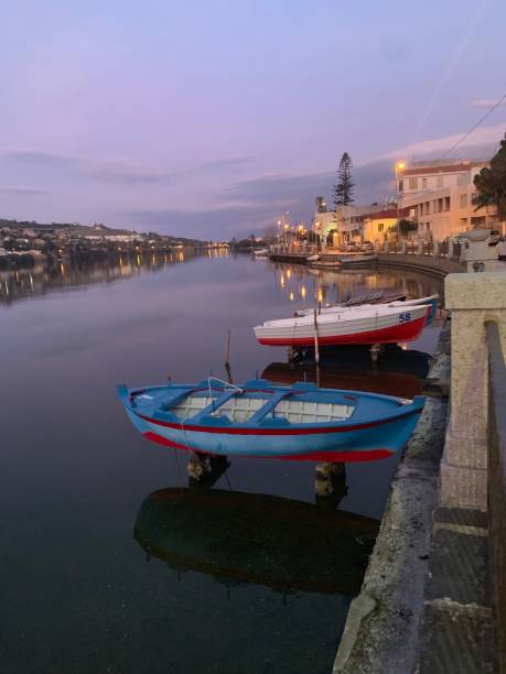 istock Italy, Sicily,Messina , two boats , two shadows 1204287045
