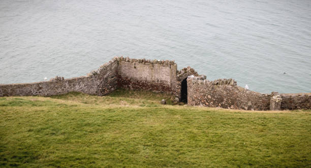 istock old stone wall in front of the sea 1204287195