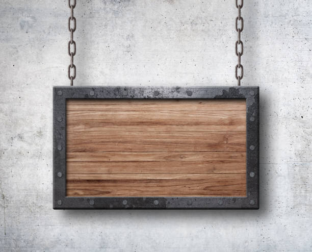 istock Grunge blank wood sign metal frame hanging on chains 1204288217