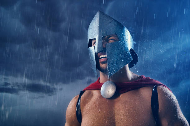 istock Spartan warrior in helmet in rain. 1204288287