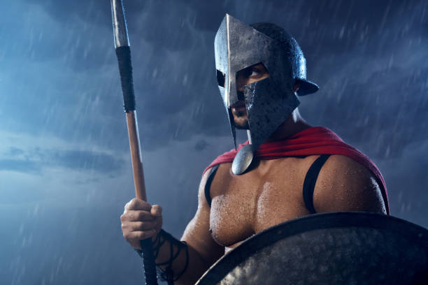 istock Wet spartan warrior holding spear and shield. 1204288306