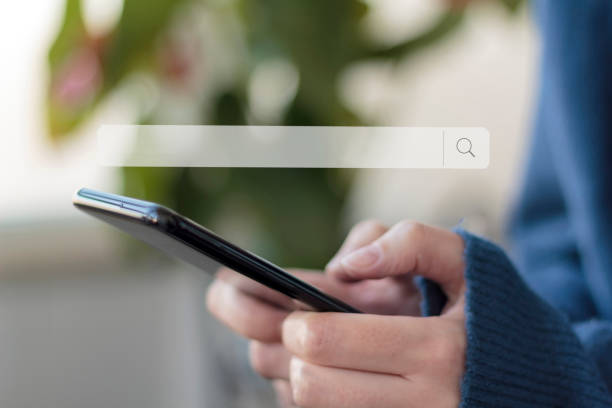 istock Woman using smartphone for online searching 1204291900