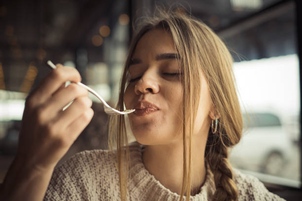 young woman eating dessert