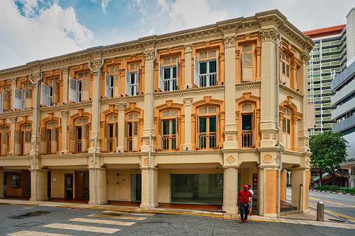 Singapore. January 2020.   The facade of a classic colonial-style building on the street in the city center