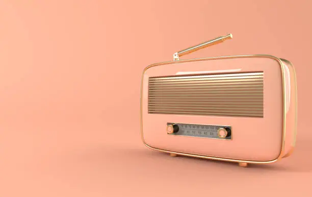 Photo of Vintage style radio receiver on pink background. Pastel colors and golden details. Retro radio realistic 3d render