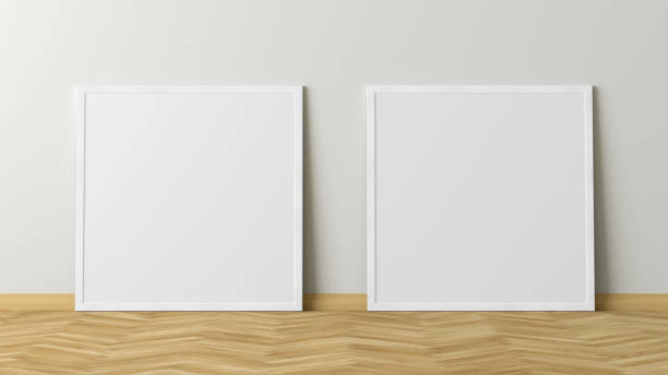 istock Blank poster frame mock up standing on the floor next to wall 1204299613