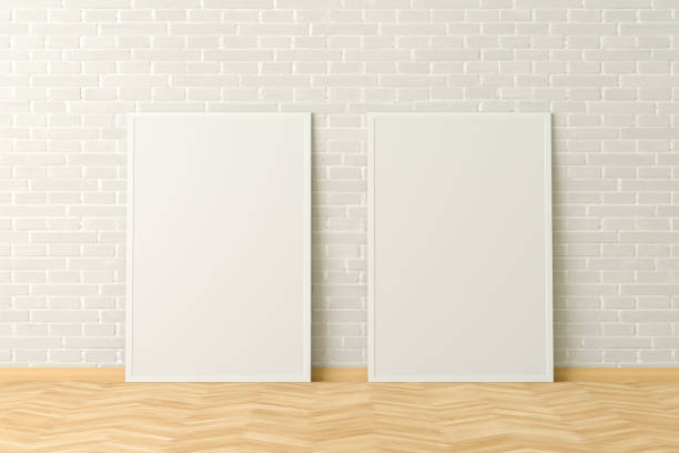 istock Blank poster frame mock up standing on the floor next to wall 1204299626