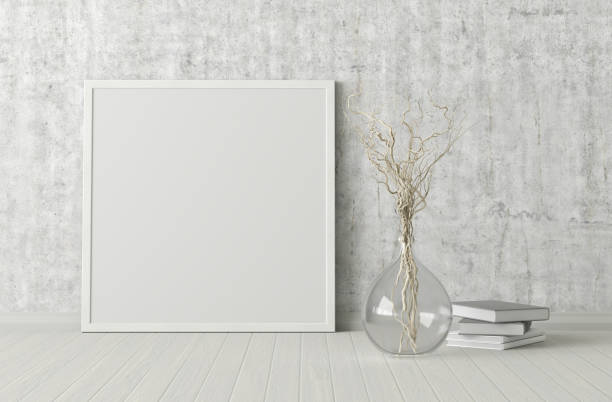 istock Blank poster frame mock up standing on the floor next to wall 1204299660