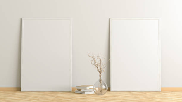 istock Blank poster frame mock up standing on the floor next to wall 1204299666