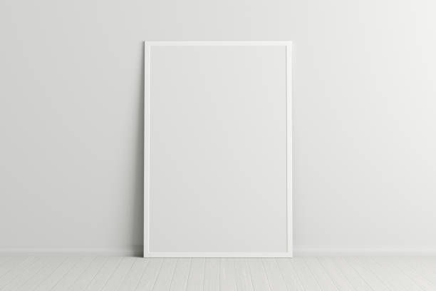 istock Blank poster frame mock up standing on the floor next to wall 1204299689