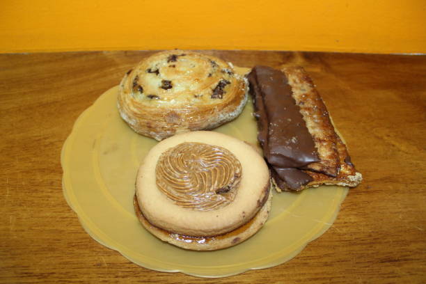 istock Three delicious pastry sweets together on a plate 1204303637