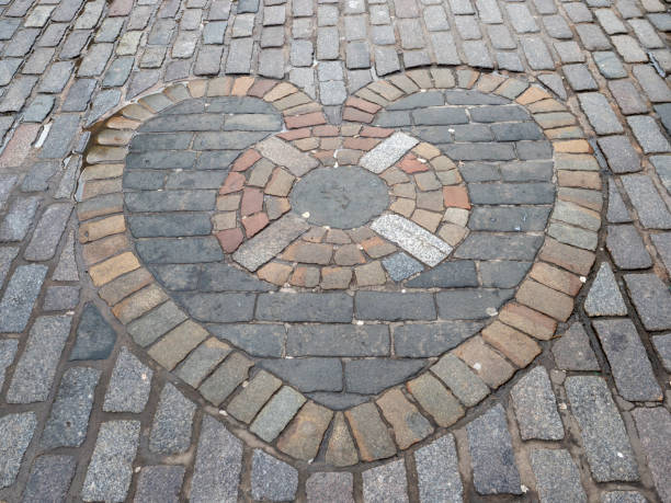 The Heart of Midlothian, a heart shaped pattern of cobblestones in the Royal Mile, Edinburgh, Scotland.\nIt is considered good luck to spit onto the stone when passing by.