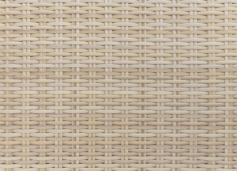 Full frame studio shot of synthetic rattan wicker weave texture background